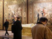 Recently preserved tapestries are displayed in an exhibit at the Cathedral of St. John the Divine in New York Wednesday.