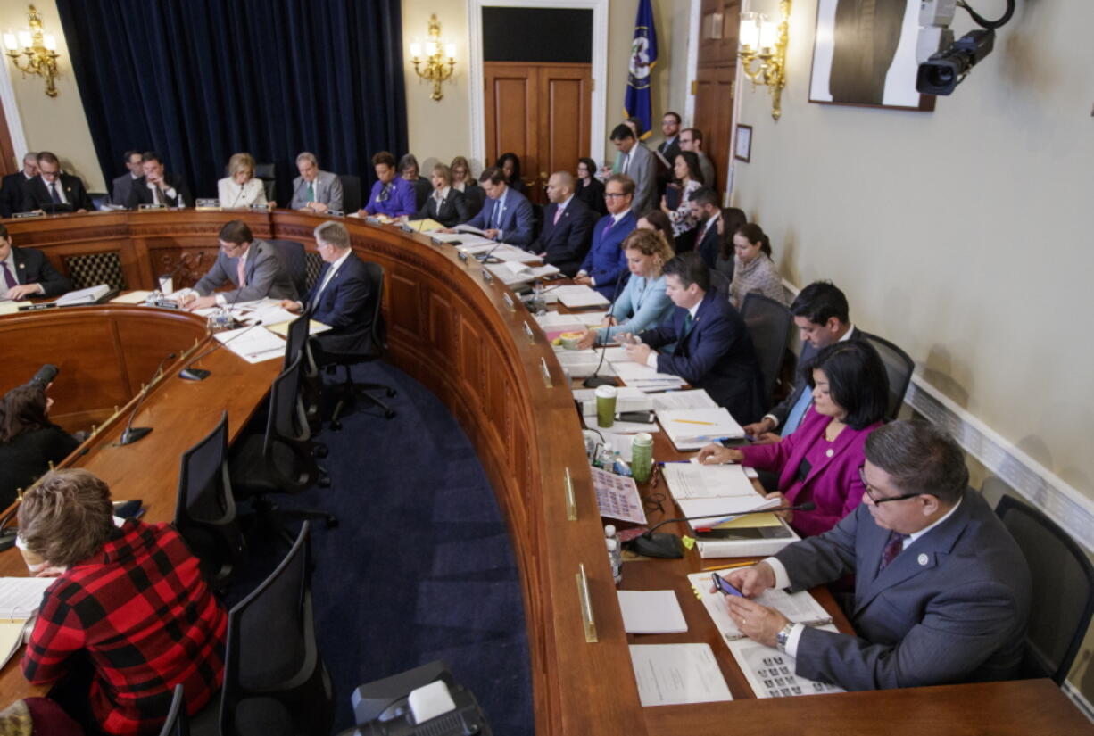 The House Budget Committee works on the Republican health care bill, on Capitol Hill in Washington on Thursday. The House Budget Committee has voted to advance the troubled Republican health care bill. (AP Photo/J.