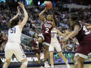 Mississippi State guard Morgan William (2) drives to the basket as Connecticut center Natalie Butler (51) defends during the first half of an NCAA college basketball game in the semifinals of the women&#039;s Final Four, Friday, March 31, 2017, Friday, March 31, 2017, in Dallas.