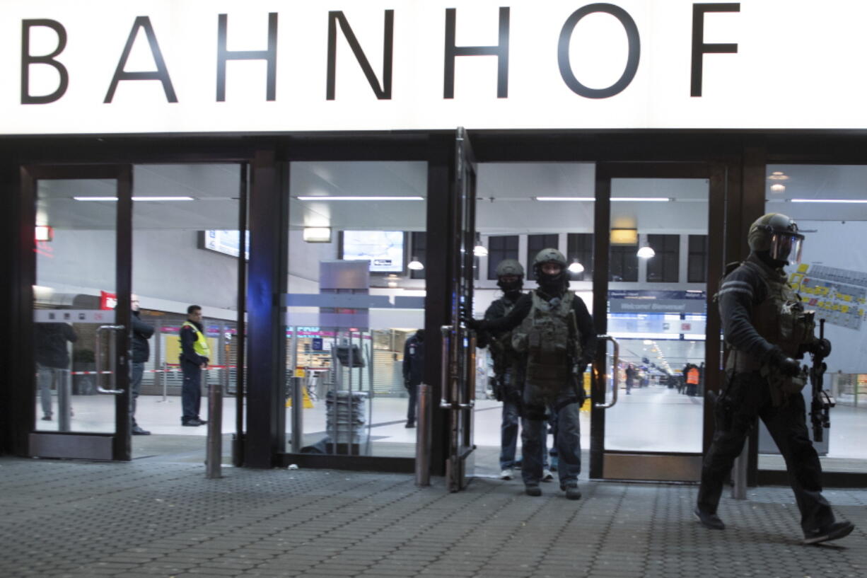 Special police forces leave the main station in Duesseldorf, Germany, on Thursday after several people were injured in an ax attack.