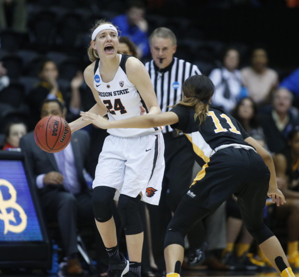 Oregon State&#039;s Sydney Wiese (24) brings the ball upcourt while guarded by Long Beach State&#039;s Martina McCowan (11) during the second half of a first-round game in the women&#039;s NCAA college basketball tournament Friday, March 17, 2017, in Corvallis, Ore. (AP Photo/ Timothy J.