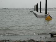 Anglers will need to wear hip boots, or possibly waders, if they want to use the dock at Marine Park along the Columbia River in Vancouver. Despite the sign, there's little chance of doing much prop damage.