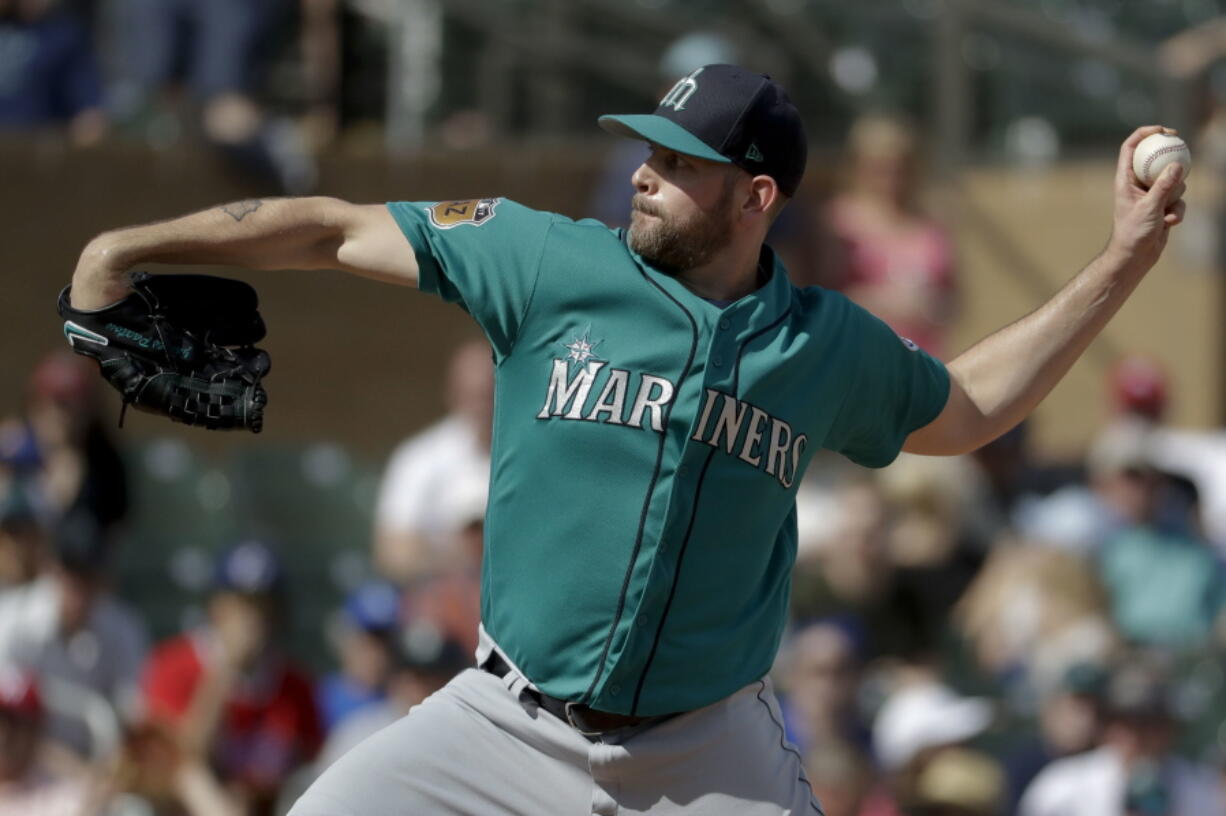 Seattle Mariners starting pitcher James Paxton trows against the Colorado Rockies during fourth inning at a spring baseball game in Scottsdale, Ariz., Saturday, March 4, 2017.