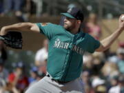 Seattle Mariners starting pitcher James Paxton trows against the Colorado Rockies during fourth inning at a spring baseball game in Scottsdale, Ariz., Saturday, March 4, 2017.