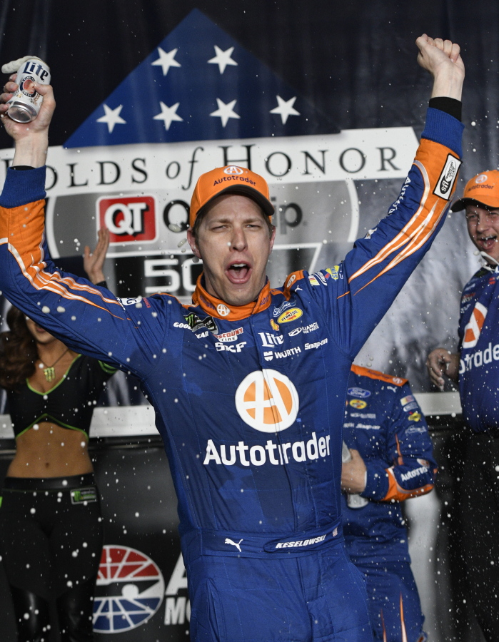 Brad Keselowski celebrates in Victory Lane after winning a NASCAR Monster Cup series auto race at Atlanta Motor Speedway in Hampton, Ga., Sunday, March 5, 2017.