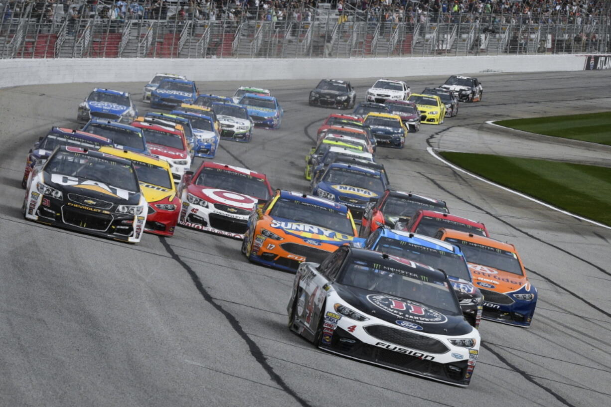 Kevin Harvick leads off the start during a NASCAR Monster Cup series auto race at Atlanta Motor Speedway in Hampton, Ga., Sunday, March 5, 2017.