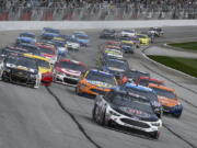 Kevin Harvick leads off the start during a NASCAR Monster Cup series auto race at Atlanta Motor Speedway in Hampton, Ga., Sunday, March 5, 2017.