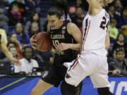 Florida State guard Leticia Romero, left, drives against Oregon State guard Sydney Wiese during the first half of a regional semi-final round game of an NCAA college basketball tournament, Saturday, March 25, 2017, in Stockton, Calif.