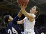 Washington's Kelsey Plum, right, drives as Montana State's Oliana Squires defends during the second half of a first-round game in the NCAA women's college basketball tournament Saturday, March 18, 2017, in Seattle. Washington won 91-63.