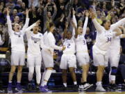 Washington players on the bench react to a 3-point basket during their 108-82 win over Oklahoma on Monday.