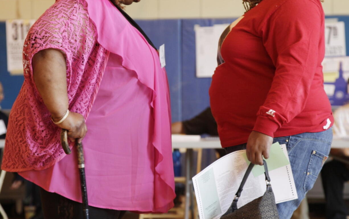 Two women converse in New York in 2012. &quot;Socially accepted normal body weight is shifting toward heavier weight. As more people around us are getting heavier, we simply believe we are fine, and no need to do anything with it,&quot; said Dr. Jian Zhang, a public health researcher at Georgia Southern University and the lead author in a study released Tuesday.