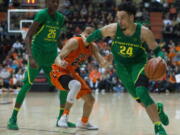 Oregon&#039;s Dillon Brooks (24) gets past Oregon State&#039;s Kendal Manuel (24) during the second half of an NCAA college basketball game Saturday, March 4, 2017, in Corvallis, Ore. Oregon won 80-59. (AP Photo/Timothy J.