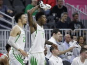 Dillon Brooks, left, and Jordan Bell celebrate a basket by the Ducks in Oregon&#039;s 80-57 win over Arizona State.