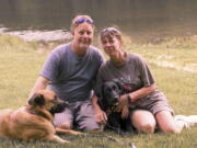 John and Amy Hunter with their dogs, Apollo, left, and Rubi, a black Labrador retriever, in Brown County State Park south of their home in Indianapolis, Ind., in 2015. The couple is childless by choice and Amy is a stay-at-home pet mom.