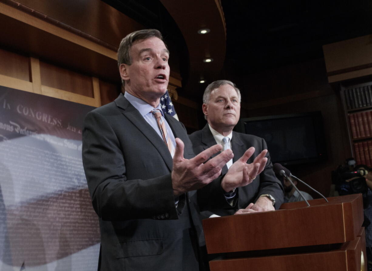 Senate Intelligence Committee Vice Chairman Sen. Mark Warner, D-Va., left, with Committee Chairman Sen. Richard Burr, R-N.C., speaks during a news conference on Capitol Hill in Washington on Wednesday to discuss their panel&#039;s investigation of Russian interference in the 2016 election. (AP Photo/J.