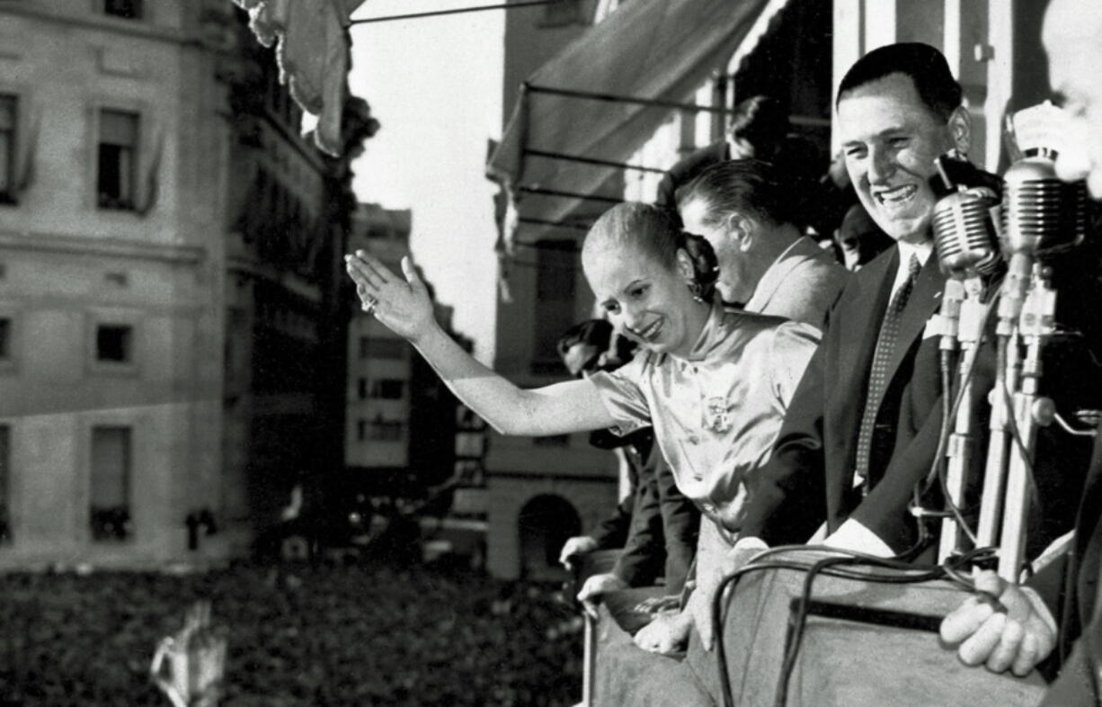 President Juan Peron and his wife Eva wave Oct. 17, 1950 from the balcony of Casa Rosada, Government House, in Buenos Aires as Argentina celebrated Loyalty Day. Decades after Eva Peron&#039;s death, tourists still visit the site where she greeted adoring masses from the balcony.