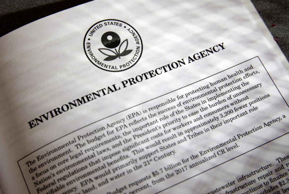 Proposals for the Environmental Protection Agency in President Donald Trump&#039;s first budget are displayed at the Government Printing Office in Washington. President Donald Trump will sign an executive order on March 29 that will suspend, rescind, or flag for review more than half-a-dozen measures that were part of former President Barack Obama???s sweeping plan to curb global warming. (AP Photo/J.