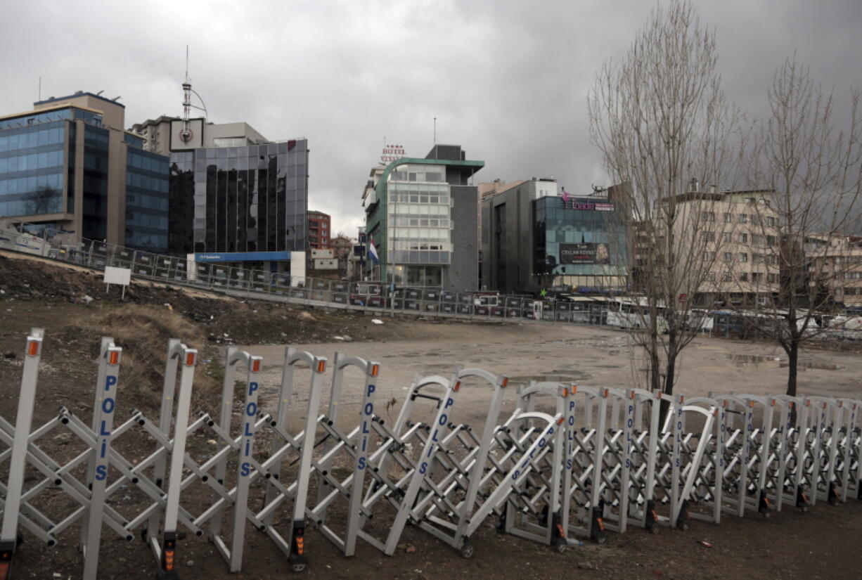 Turkish security barricades surround the Dutch embassy, the green building at the center, in Ankara, Turkey, on Monday. Tensions between Turkey and Western Europe simmered Monday, with Turkey&#039;s foreign ministry formally protesting the treatment of a Turkish minister who was escorted out of the Netherlands over the weekend and what Turkey called a &quot;disproportionate&quot; use of force against demonstrators at a protest afterward.