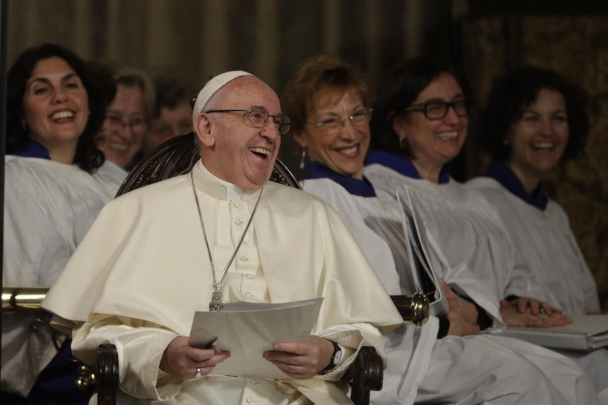 Pope Francis shares a light moment during his historic visit to the Anglican Church of All Saints in Rome on Feb. 26.