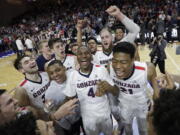 Gonzaga players celebrate after defeating Saint Mary&#039;s in an NCAA college basketball game during the championship of the West Coast Conference tournament, Tuesday, March 7, 2017, in Las Vegas. Gonzaga won 74-56.