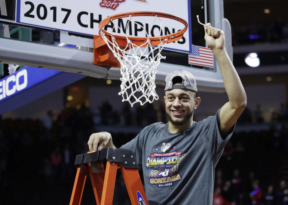 Gonzaga&#039;s Nigel Williams-Goss cuts down a piece of the net after defeating Saint Mary&#039;s in an NCAA college basketball game during the championship of the West Coast Conference tournament, Tuesday, March 7, 2017, in Las Vegas. Gonzaga won 74-56.