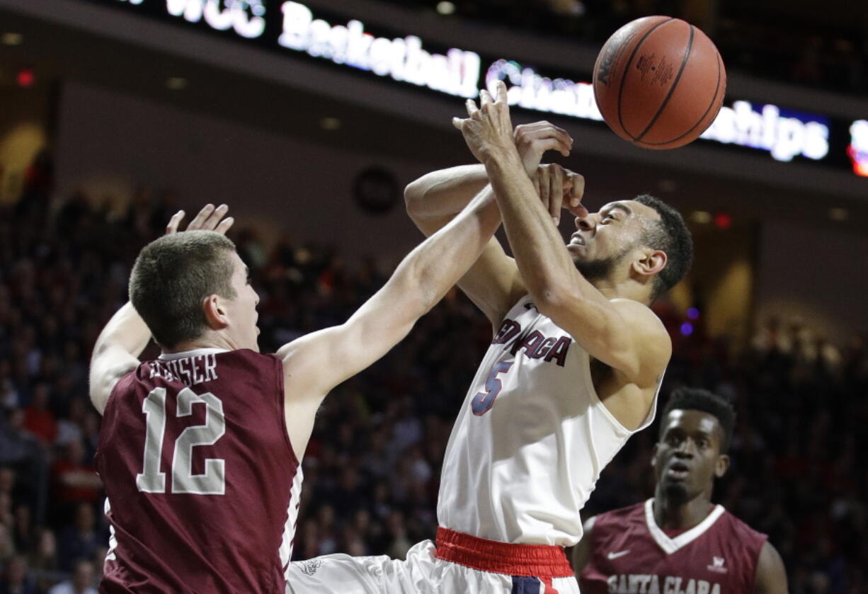 Santa Clara&#039;s Matt Hauser, left, fouls Gonzaga&#039;s Nigel Williams-Goss during the first half of a West Coast Conference tournament NCAA college basketball game Monday, March 6, 2017, in Las Vegas.