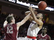 Santa Clara&#039;s Matt Hauser, left, fouls Gonzaga&#039;s Nigel Williams-Goss during the first half of a West Coast Conference tournament NCAA college basketball game Monday, March 6, 2017, in Las Vegas.