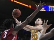 UCLA guard Bryce Alford, right, shoots as Washington State forward Robert Franks defends during the second half of an NCAA college basketball game, Saturday, March 4, 2017, in Los Angeles. (AP Photo/Mark J.