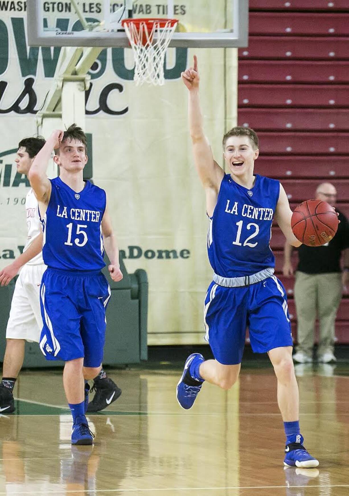 La Center guard, Avery Seter (12), celebrates as time runs out against Newport during the WIAA 1A boys state tournament finals, on Saturday, Mar. 4, 2017 at the Yakima Valley SunDome. La Center defeated Newport 51-38, winning fourth place.