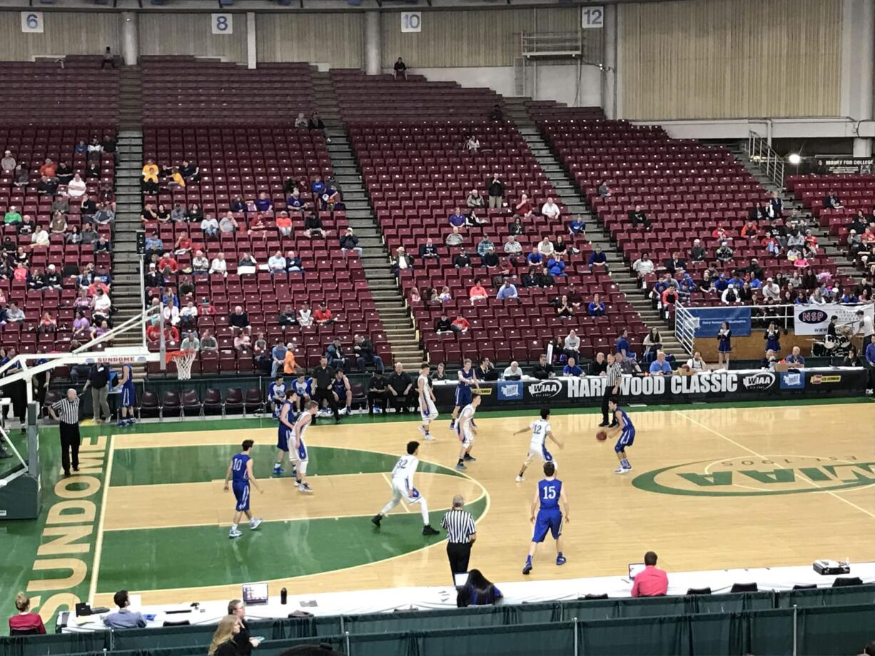 Hunter Ecklund (with ball) and the La Center Wildcats topped Warden in overtime, 49-42, Friday to advance to Saturday's fourth/sixth-place game.