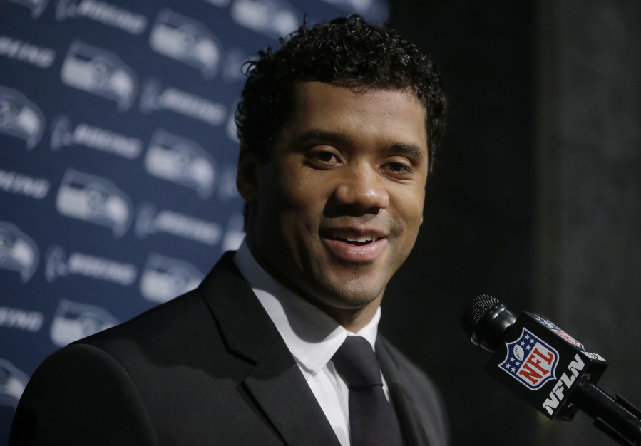 Seattle Seahawks quarterback Russell Wilson speaks to the media following an NFL football game against the New England Patriots, Monday, Nov. 14, 2016, in Foxborough, Mass.