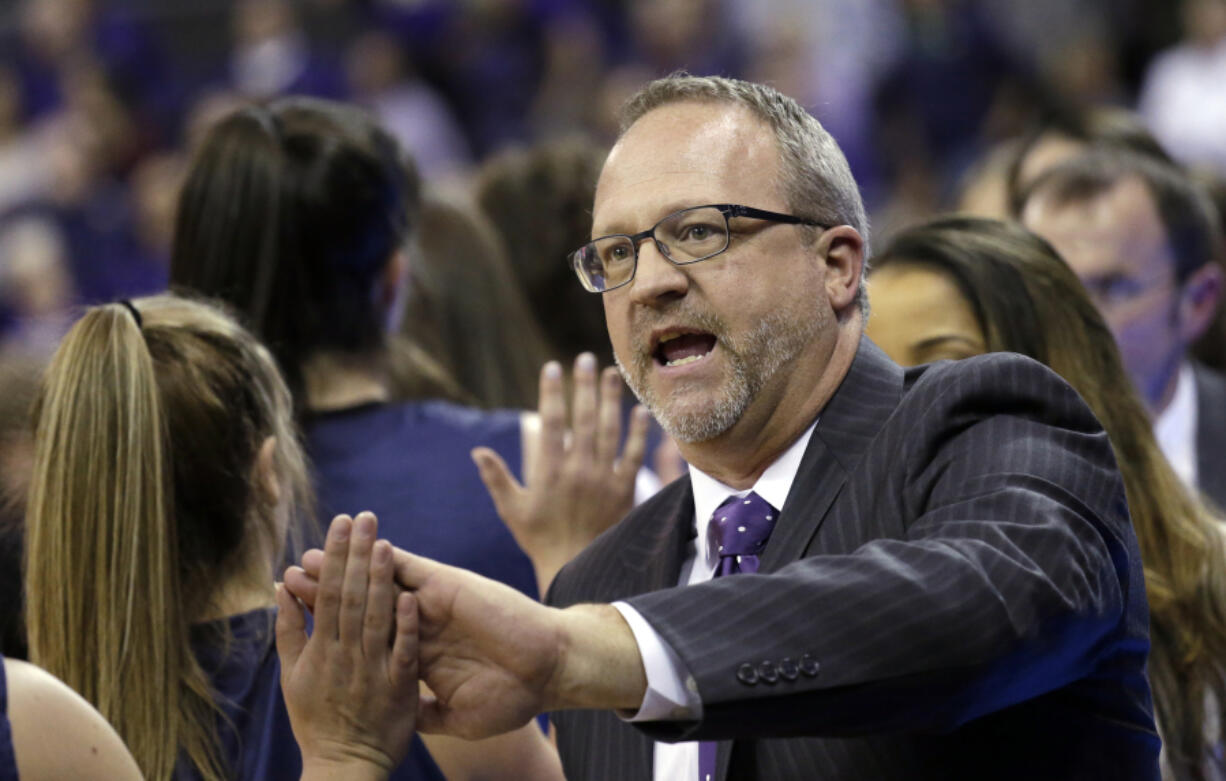 Washington head coach Mike Neighbors greets Montana State players and coaches after a first-round game in the NCAA womenis college basketball tournament Saturday, March 18, 2017, in Seattle. Washington won 91-63.