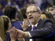 Washington head coach Mike Neighbors greets Montana State players and coaches after a first-round game in the NCAA womenis college basketball tournament Saturday, March 18, 2017, in Seattle. Washington won 91-63.