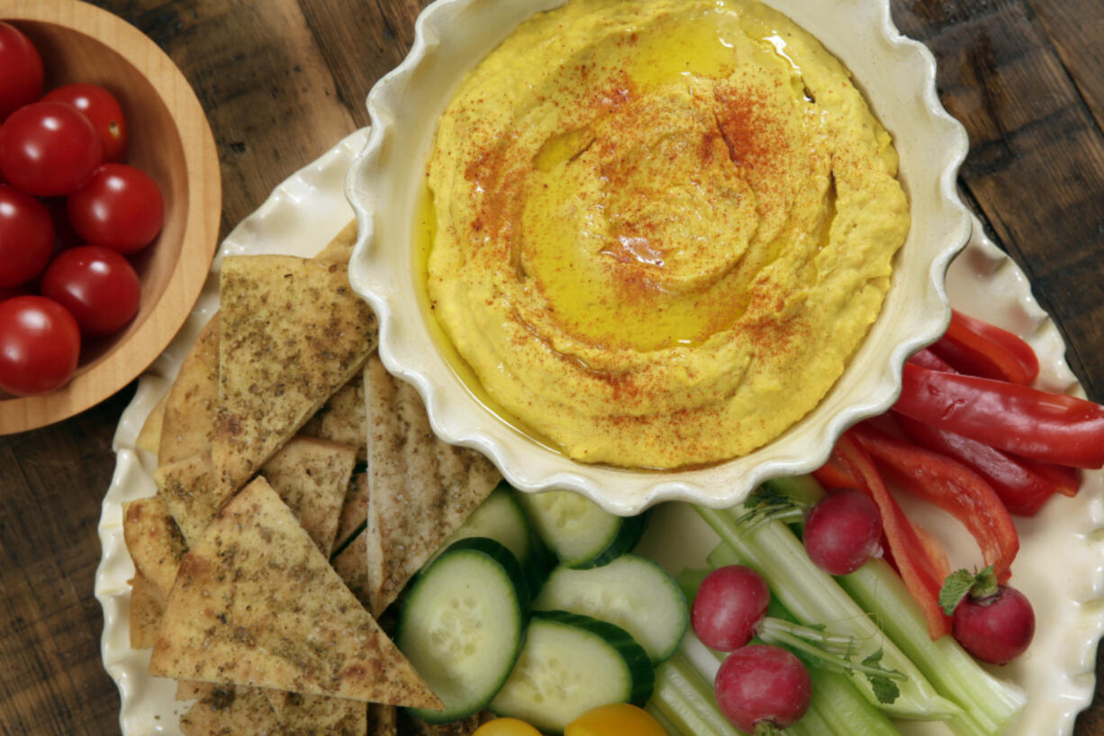 Roasted carrot hummus with pita chips and crudite.