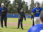 Bonnie Owen, a member of the U.S. Navy&#039;s WAVES during World War II, throws out a ceremonial opening pitch Sunday before Clark College&#039;s baseball game against the Linfield junior varsity. Sunday was Military Appreciation Day at Kindsfather Field. Malcolm Cameron, left, 77, is an Army veteran. (Randy L.