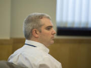 Stephen Reichow listens to opening statements in his murder trial April 6 in Clark County Superior Court. The jury on Monday convicted Reichow in the fatal beating of an acquaintance with a baseball bat in August 2015 in Battle Ground.