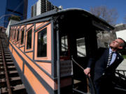 Los Angeles Mayor Eric Garcetti poses for pictures March 1 after joining city officials, contractors and dignitaries for a press conference, announcing the refurbishment and reopening of the historic Angels Flight railway in downtown L.A.