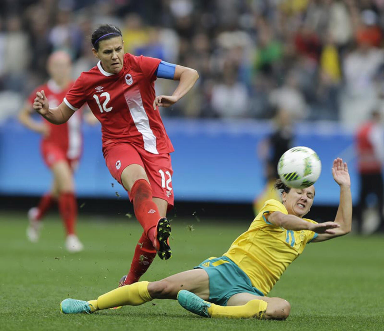 Canada&#039;s Christine Sinclair, left, scores her team&#039;s 2nd goal, during the 2016 Summer Olympics football match between Canada and Australia, at the Arena Corinthians, in Sao Paulo, Brazil, Wednesday, Aug. 3, 2016. Canada won 2-0.