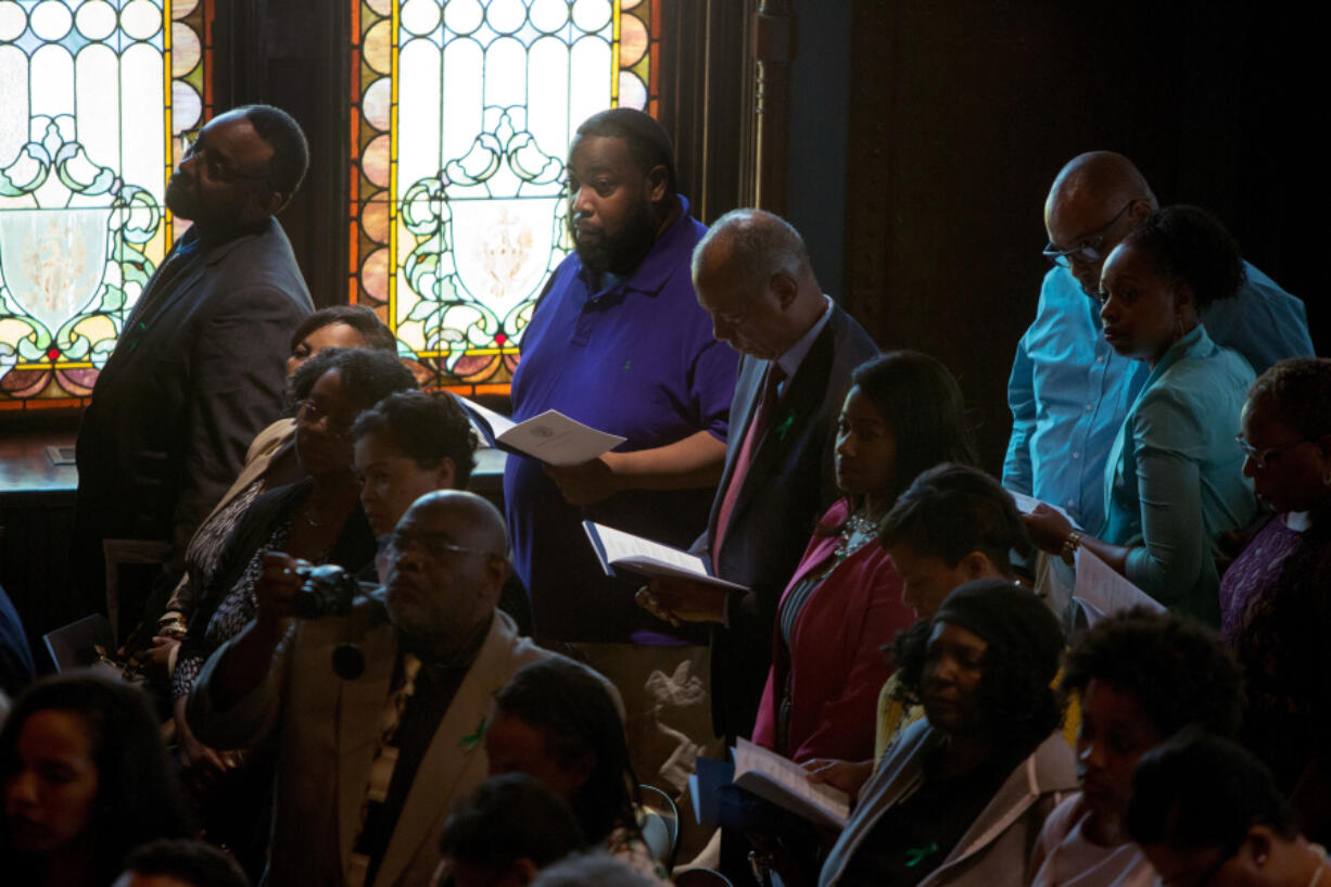 Descendants of the 272 enslaved sold by Georgetown University in 1838, participate Tuesday in a Liturgy of Remembrance, Contrition and Hope on the campus of Georgetown University in Washington.