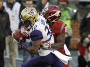 Washington&#039;s Budda Baker (32) is one of the top defensive back prospects in the NFL Draft. He could be available when Seattle picks No. 26. (Ted S.