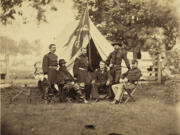 Gen. Phil Sheridan, in front of the flag, with his staff in 1864. Sheridan served at Fort Vancouver before the Civil War. Gen. James Wilson, left, spent nearly a year at Fort Vancouver before the war. Wilson commanded the troops who captured Confederate president Jefferson Davis.