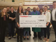 Minnehaha: Employees from the Hazel Dell Fred Meyer present a check to Clark County Food Bank representatives.