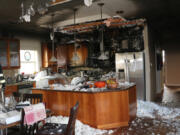 The aftermath of a kitchen fire that spread to an Arnada neighborhood home&#039;s attic Thursday afternoon. No one was hurt, and fire investigators hypothesize a dog trying to take some food from the counter tripped a burner to start the fire.