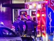 A Vancouver police officer is loaded into an ambulance after sustaining injuries during an altercation with an alleged aggressive panhandler Friday night near the corners of Sixth and Main streets in downtown Vancouver. The officer, who has not been identified, was treated at a local hospital and released, according to Vancouver police.