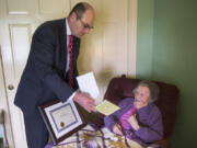 Clark County Auditor Greg Kimsey presents Mable Engeman, the county&#039;s oldest eligible voter, with a certificate of appreciation for all the votes she&#039;s cast since she became eligible to vote in 1934.