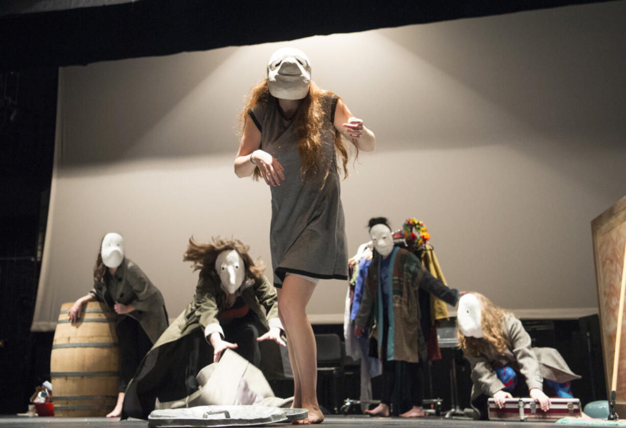 Students and graduates of the Vancouver School of Arts and Academics have developed an original pantomime play as a gift for the students of the Washington School for the Deaf. These strange people are masked &quot;types&quot; who improvise their way through a style of Renaissance clowning called commedia dell&#039;arte. That&#039;s sophomore Eliana Stemm at center.