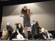 Students and graduates of the Vancouver School of Arts and Academics have developed an original pantomime play as a gift for the students of the Washington School for the Deaf. These strange people are masked &quot;types&quot; who improvise their way through a style of Renaissance clowning called commedia dell&#039;arte. That&#039;s sophomore Eliana Stemm at center.