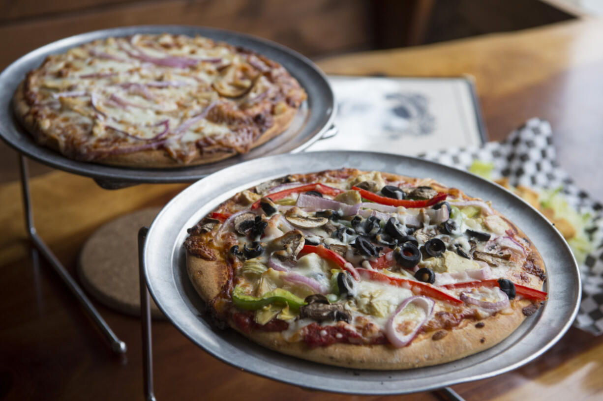 The herbivore pizza, front, is pictured next to the Sweet Baby pizza at A Beer at a Time in Camas.