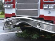 A Vancouver firetruck was damaged after a large tree fell on it on East Mill Plain Boulevard in Vancouver Friday.