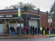 A line of customers wait to enter Main Street Marijuana&#039;s Uptown Village location Thursday during their 420 sale.